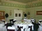 White Chair Covers and Chocolate Taffeta Sash